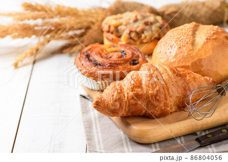 Butter Croissant with Sourdough and Danish Pastry on white wood background, Butter Croissant with Sourdough and Danish Pastry on white wood background, 86804056