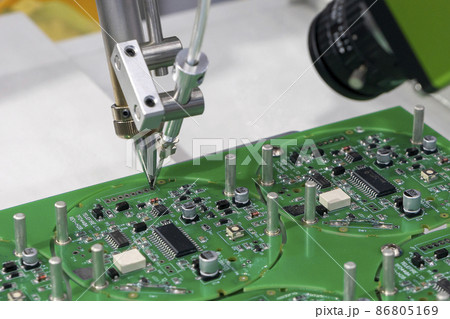 The automatic soldering robot operation with PCB board. The automatic soldering robot operation with PCB board. 86805169