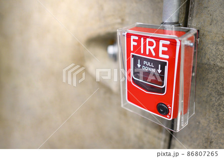 Fire alarm switch on the wall 86807265