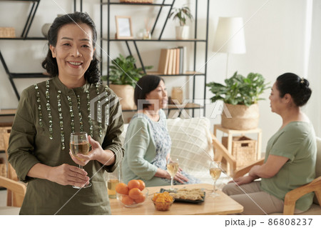 Aged Woman Drinking Champagne Aged Woman Drinking Champagne 86808237