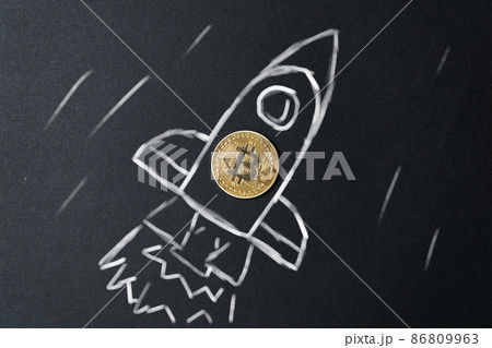 Rocket with cryptocurrency. The concept of rate success and wealth growth in business. Rocket with cryptocurrency. The concept of rate success and wealth growth in business. 86809963