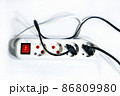 Extension cord with a button on a white background. Isolate. Copy space.View from above. Flat lay. 86809980
