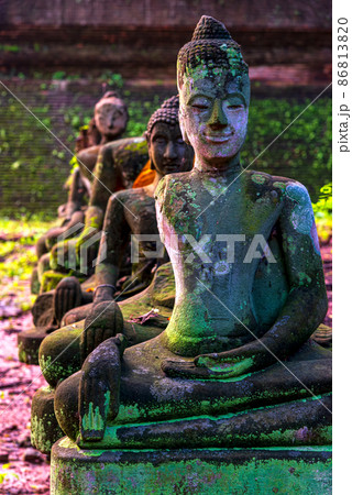 Ancient Wreckage Buddha Statue at U Mong Temple in Chiang Mai, Thailand. 86813820