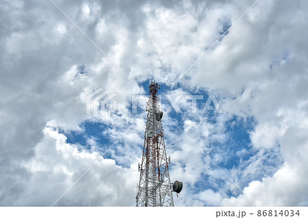 White clouds on blue sky with Telecommunication towers. White clouds on blue sky with Telecommunication towers. 86814034