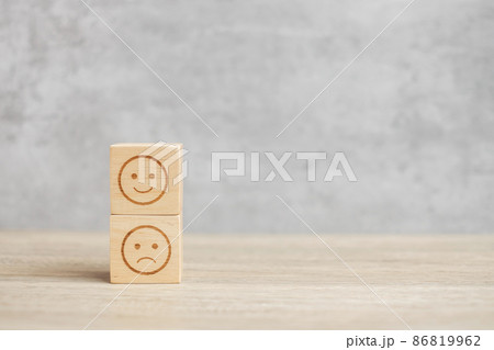 emotion face symbol on wooden blocks. mood, Service rating, ranking, customer review, satisfaction, evaluation and feedback concept 86819962
