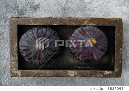 Healthy dessert figs, on gray stone table background, top view flat lay Healthy dessert figs, on gray stone table background, top view flat lay 86820934