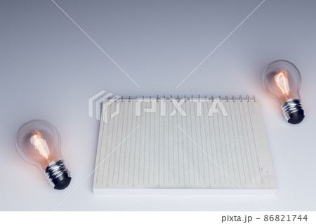 bulb and sucess concept with note paper mock up bulb and sucess concept with note paper mock up 86821744