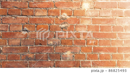 Background of old vintage brick wall in soft diffused light Background of old vintage brick wall in soft diffused light 86825493