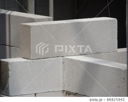SEREMBAN, MALAYSIA -FEBRUARY 2, 2021: Blockwork by construction workers at the construction site. The bricks are stacked to form the walls as designed by the architect. 86825942