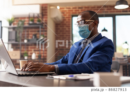 Person looking at laptop screen to plan business project during coronavirus pandemic Person looking at laptop screen to plan business project during coronavirus pandemic 86827913