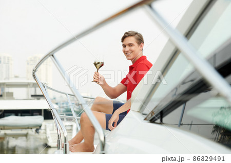 Man Celebrating Success on Yacht 86829491