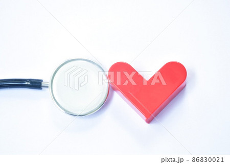 red heart and stethoscope medical equipment for doctor listening pulse of patient on white background red heart and stethoscope medical equipment for doctor listening pulse of patient on white background 86830021