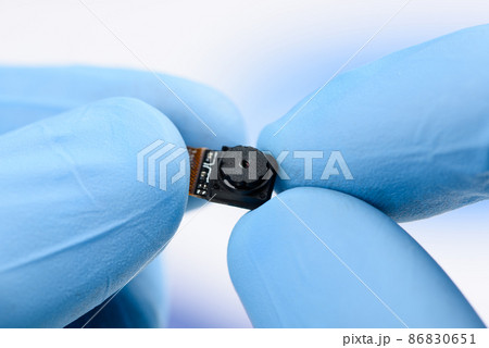 Camera module in scientist hands. Camera module in scientist hands. 86830651