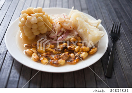 Peruvian traditional dish.fish ceviche with yuka and corn 86832381