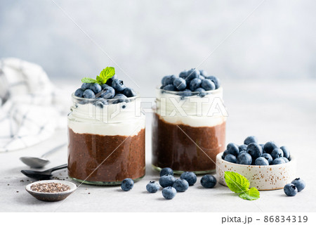 Vegetarian chocolate pudding with yogurt and blueberries Vegetarian chocolate pudding with yogurt and blueberries 86834319