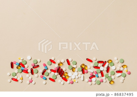 Protective face masks or surgical masks, medicine pills and thermometer on table background. Coronavirus disease. Corona virus concept. Space for text 86837495