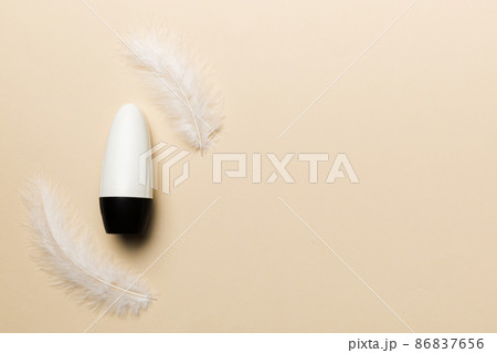 Set of skin care serums on pink pastel background with ostrich feathers. Spa cosmetic product, cream jar, branding mock up, top view with copy space Set of skin care serums on pink pastel background with ostrich feathers. Spa cosmetic product, cream jar, branding mock up, top view with copy space 86837656