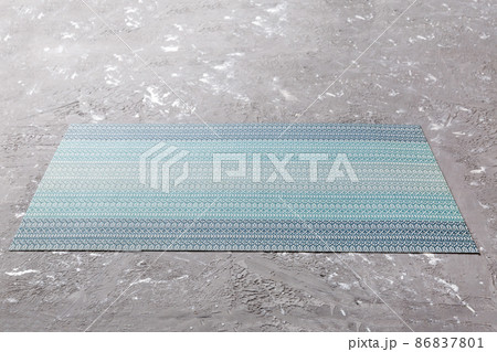 Perspective view of blue tablecloth for food on cement background. Empty space for your design Perspective view of blue tablecloth for food on cement background. Empty space for your design 86837801
