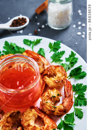 Grilled shrimps on plate with fresh parsley, fried prawns 86838639