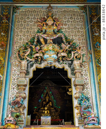 Elaborate sculptures entrance the Buddhist church at the famous of The Pariwas temple. 86838642