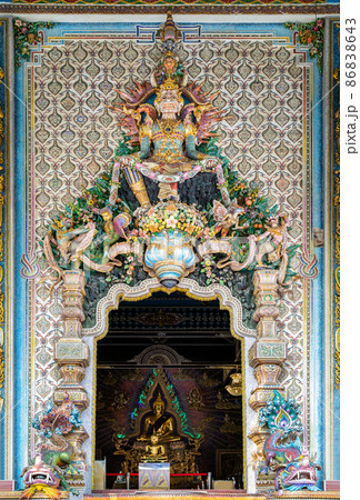 Elaborate sculptures entrance the Buddhist church at the famous of The Pariwas temple. 86838643