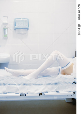Surgery compression stockings. Empty interior operating room and modern equipment in hospital. Medical device for surgeon surgical emergency patient in blue tone. Save life medical treatment concept. Surgery compression stockings. Empty interior operating room and modern equipment in hospital. Medical device for surgeon surgical emergency patient in blue tone. Save life medical treatment concept. 86838720