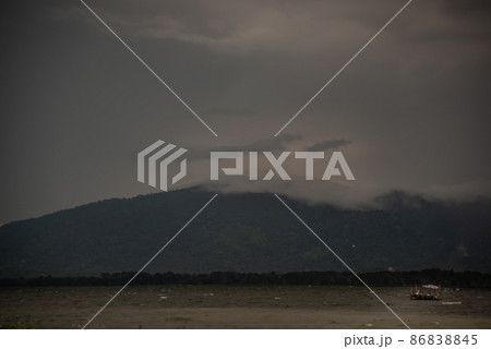 The beauty of Bang Phra Reservoir on the background of misty capped mountains, Chonburi Province. 86838845