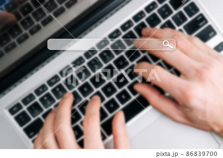 Searching internet. Online website search engine selective focus. Blured hands using computer for searching browsing internet data information networking concept. Searching internet. Online website search engine selective focus. Blured hands using computer for searching browsing internet data information networking concept. 86839700