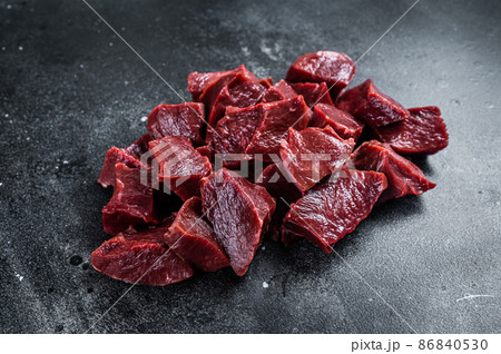 Raw sliced Beef or veal heart. Black background. Top View Raw sliced Beef or veal heart. Black background. Top View 86840530