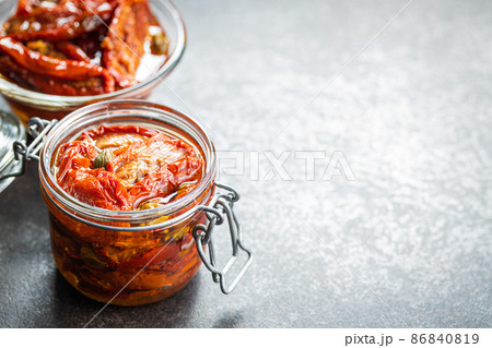 Sun dried tomatoe. Pickled tomatoes jar. 86840819