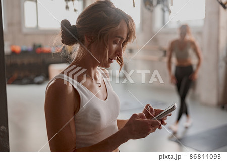 Attractive woman after functional training in gym 86844093