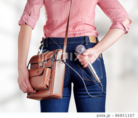 Female journalist with microphone Female journalist with microphone 86851107