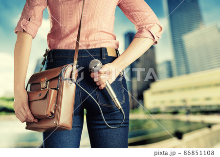 Female journalist with microphone Female journalist with microphone 86851108