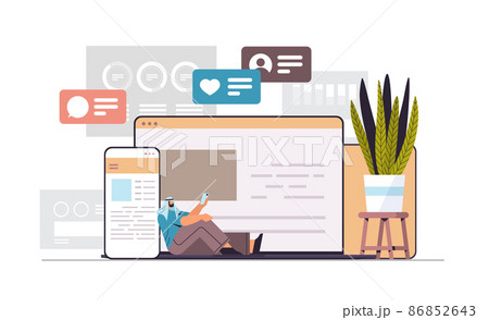 arab man using computer and mobile chatting apps online communication social media network digital addiction 86852643