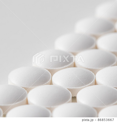 Rows of pills on a white background. Health care, medicine, pharmacy and disease concept Rows of pills on a white background. Health care, medicine, pharmacy and disease concept 86853667