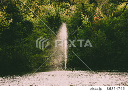 A fountain in a public park A fountain in a public park 86854746