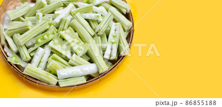 Moringa oleifera in bamboo plate on yellow background Moringa oleifera in bamboo plate on yellow background 86855188