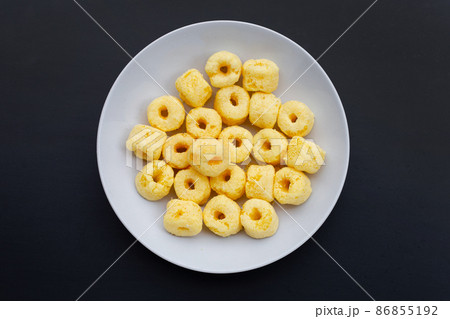 Roller corn snack on dark background 86855192