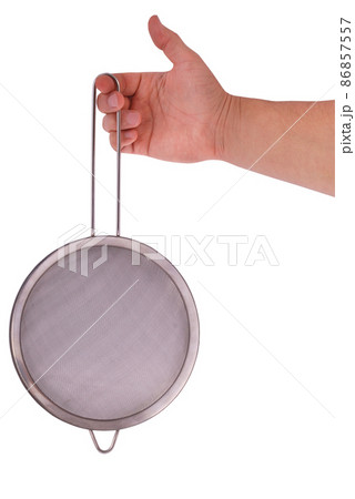 Metal colander in hand 86857557