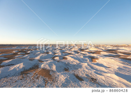 Extraordinary White Desert landscape with a light blue sky Extraordinary White Desert landscape with a light blue sky 86860428