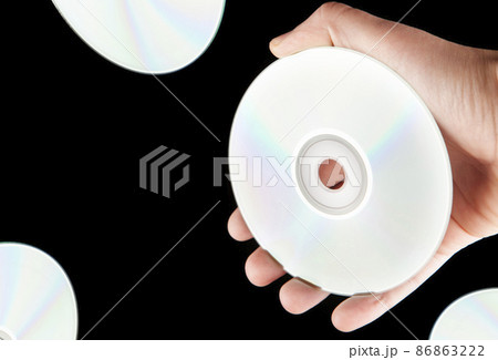 image of cd disk hand dark background  86863222