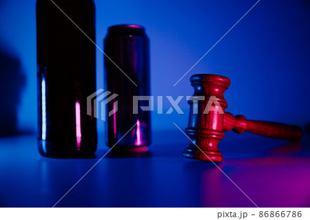 Bottle with whisky, jar of beer and judge gavel, alcohol and crimes concept Bottle with whisky, jar of beer and judge gavel, alcohol and crimes concept 86866786