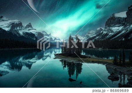 Landscape of Spirit Island with Aurora Borealis over Canadian Rockies and crescent moon on Maligne lake at Jasper national park 86869689