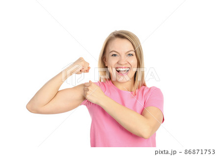 Young woman showing biceps, isolated on white background 86871753
