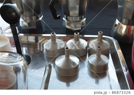 Basket for Moka coffee pot traditional Italian espresso on table of slow bar coffee maker. 86873326