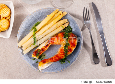 Fresh salmon steak with bunch of roasted asparagus 86876806