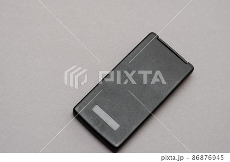 Closed Scientific calculator opposite the gray background. Rectangular device designed for engineering and scientific Closed Scientific calculator opposite the gray background. Rectangular device designed for engineering and scientific 86876945