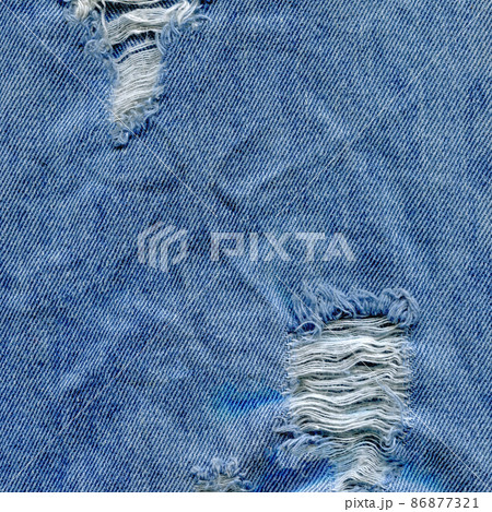 Jeans torn denim texture. Denim jeans ripped 86877321