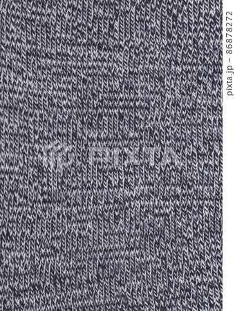 Warm black and white wool sweater texture. Knitted fabric background. Warm black and white wool sweater texture. Knitted fabric background. 86878272