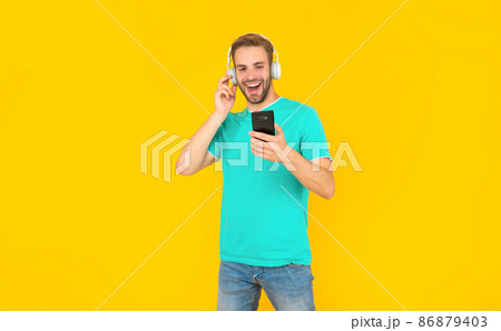 Feel the music you are listening. Happy guy listen to mobile music on phone. Listening to podcast Feel the music you are listening. Happy guy listen to mobile music on phone. Listening to podcast 86879403